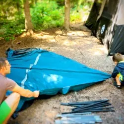 Chris Taylor and LittleMan setting up Camping