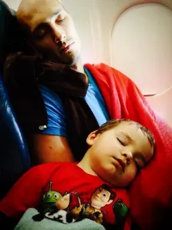 Daddy and LittleMan sleeping on plane
