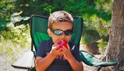 LittleMan eating Apple camping Glacier National Park 1