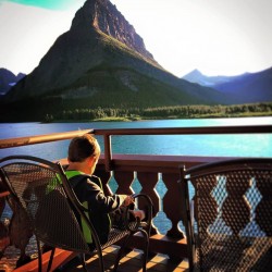 LittleMan on balcony at Many Glacier Hotel Swiftcurrent Lake