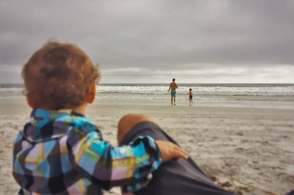 Chris Taylor and LittleMan running into surf Jax Beach Casa Marina 2
