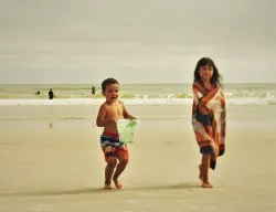 LittleMan and Friend playing in sand at Jacksonville Beach