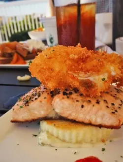 Poached Salmon with Crispy Egg and Grits at Echo Restaurant King and Prince Resort St Simons GA