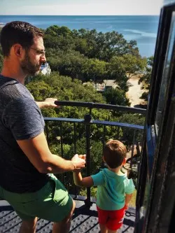 Chris Taylor and LittleMan at the Top of St Simons Island Lighthouse Georgia 2traveldads.com