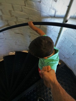 LittleMan climbing down spiral staircase of St Simons Island Lighthouse Georgia 2traveldads.com