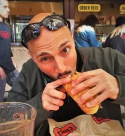 Rob Taylor Eating Bratwurst at Sausage Garten Leavenworth WA 2traveldads.com