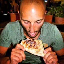 Rob Taylor eating pizza in Florence Italy