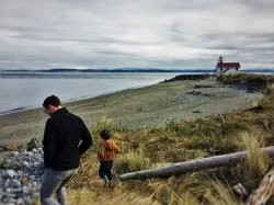 Chris Taylor and LittleMan on beach at Point Wilson Lighthouse Fort Worden Port Townsend 1