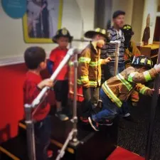 Kids in Costume and Fire Pole at Fire Station No 1 at Childrens Museum of Denver 1
