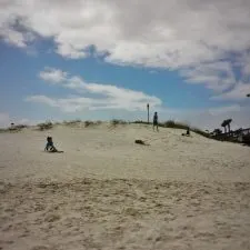 Kids playing on dunes at Jacksonville Beach Florida 1