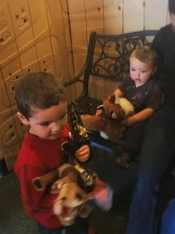 Taylor Kids playing with animal puppets in backyard area at Childrens Museum of Denver 1