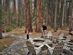 Chris Taylor and LittleMan by fire pit at Evergreen Lodge at Yosemite 2traveldads.com