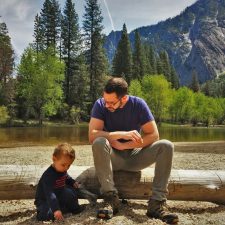 Chris Taylor and LittleMan picnic at Cathedral Merced River in Yosemite National Park 2traveldads.com