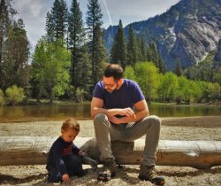 Chris Taylor and LittleMan picnic at Cathedral Merced River in Yosemite National Park 2traveldads.com