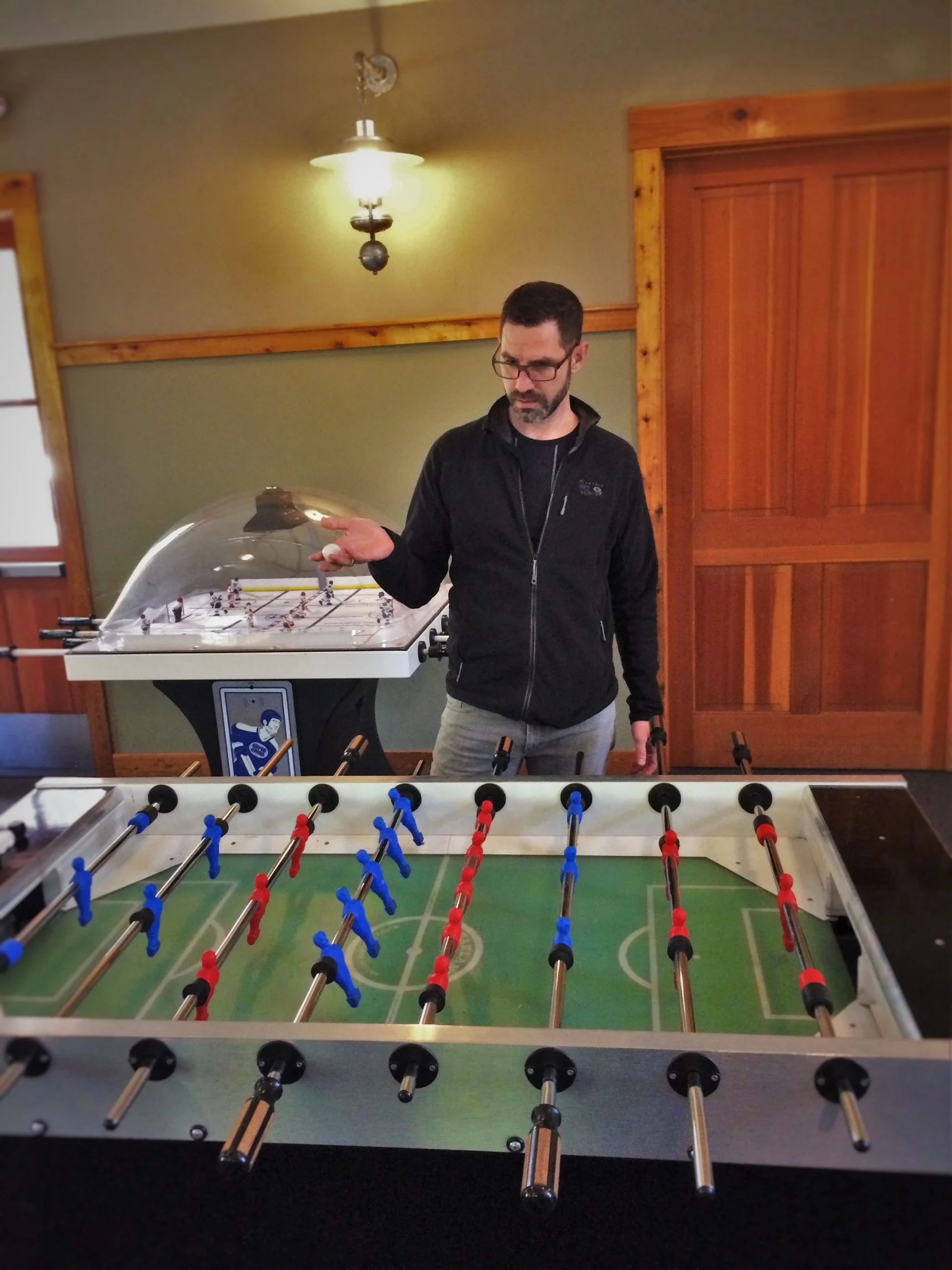 Chris Taylor playing foosball at Evergreen Lodge at Yosemite National Park 1