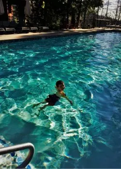 LittleMan swimming at Evergreen Lodge at Yosemite National Park 2traveldads.com