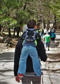 LittleMan using Piggyback Rider at Bridal Veil Falls Yosemite National Park 2traveldads.com