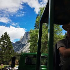 Park Ranger and Half Dome on tram tour of Yosemite Valley Floor in Yosemite National Park 1