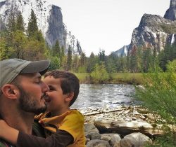 Rob Taylor and littleman Merced River in Yosemite National Park 2traveldads.com