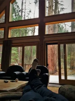 Rob Taylor feet with sequioas in John Muir House at Evergreen Lodge at Yosemite National Park 1