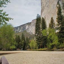Rob Taylor relaxing at Cathedral Merced River Yosemite National Park 2traveldads.com
