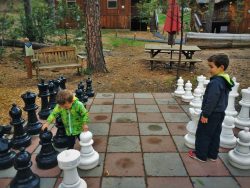 Taylor-Kids-playing-mega-chess-at-Evergreen-Lodge-at-Yosemite-National-Park-1-250x188.jpg