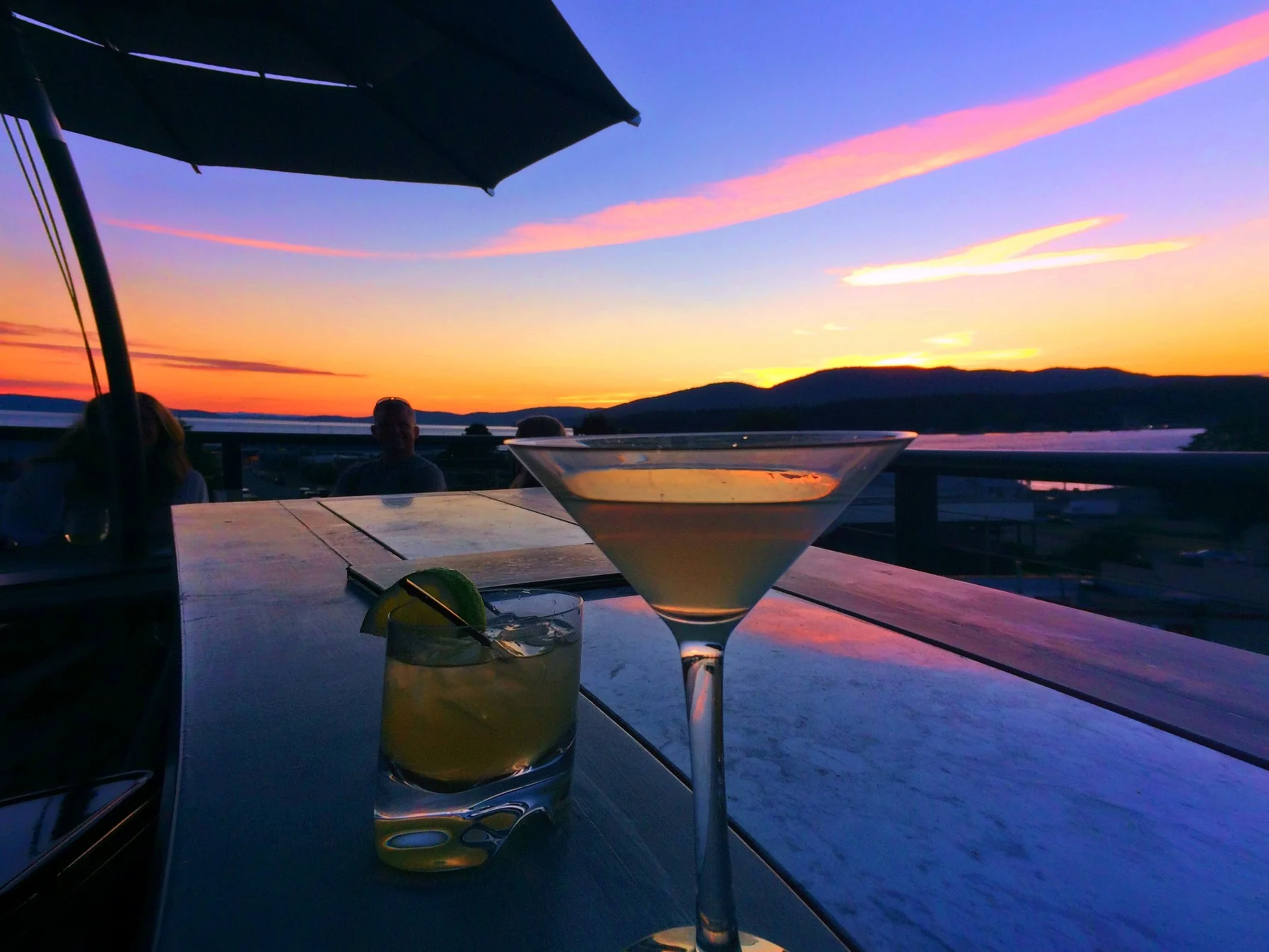 Cocktails at Sunset on Rooftop of Majestic Inn Anacortes