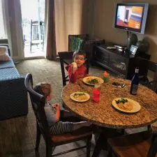 Kids eating dinner Condo unit at Pacific Reef Hotel Gold Beach Oregon Coast