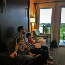 Chris Taylor and Kids watching movie in Condo unit at Pacific Reef Hotel Gold Beach Oregon Coast