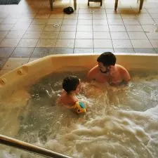 Chris Taylor and TinyMan in Hot Tub cabana at Pacific Reef Hotel Gold Beach Oregon Coast