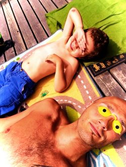Rob Taylor and LittleMan lying in sun