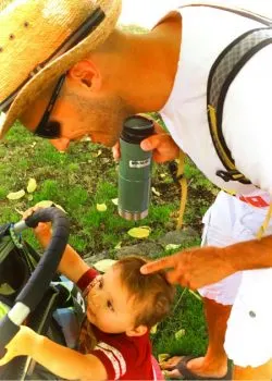 Rob Taylor and TinyMan in park using Stanley vacuum mug 2traveldads.com