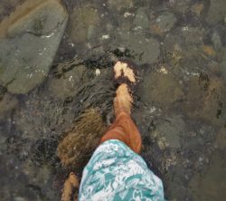 Rob Taylor walking in ocean tide at Battery Point Lighthouse Crescent City 2