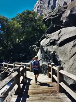 Chris Taylor crossing footbridge at Hetch Hetchy Yosemite National Park 1