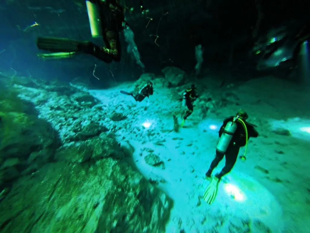 Divers Inside Mouth of Cenotes Dos Ojos Playa del Carmen Mexico 2