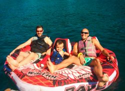 Chris and Rob Taylor with son inner tubing on Lake Cushman Olympic Peninsula 1