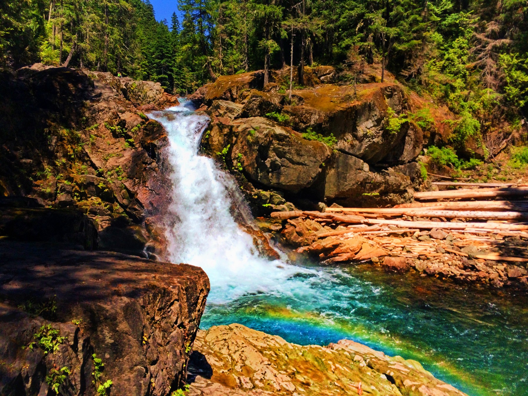 Clear water and colorful rocks and rainbow at Silver Falls Mt Rainier ...