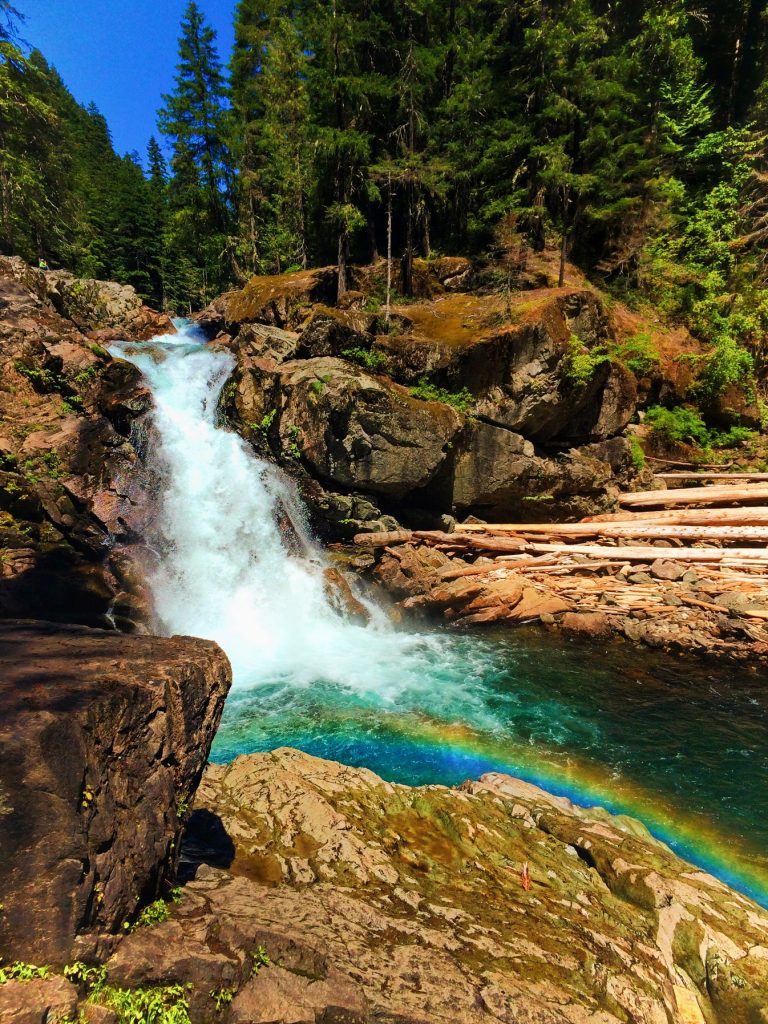 Clear water and colorful rocks and rainbow at Silver Falls Mt Rainier National Park 2