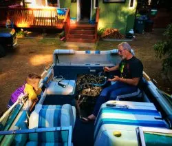 LittleMan and Grampa fixing boat at VRBO Family Reunion Lake Cushman 1