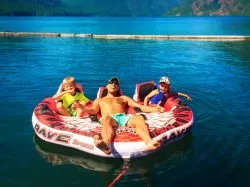 Rob Taylor and kids on inner tube at Lake Cushman Olympic Peninsula 1