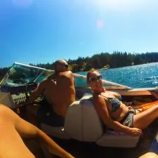 Rob Taylor driving speed boat with family at Lake Cushman Olympic Peninsula