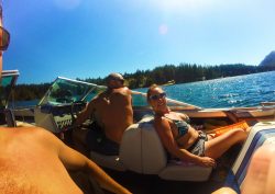 Rob Taylor driving speed boat with family at Lake Cushman Olympic Peninsula