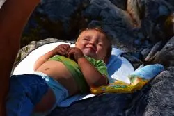 TinyMan diaper change on rocks at Silver Falls Mt Rainier National Park 1