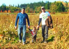 Taylor family in pumpkin patch Fall Traditions