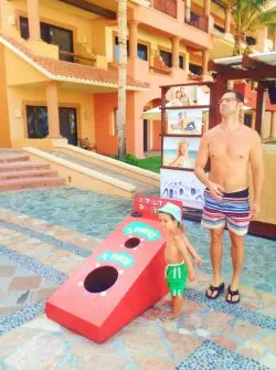 Playing Cornhole at Playa Grande while using a timeshare