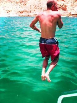 Rob Taylor jumping off snorkeling catamaran at Playa Santa Maria