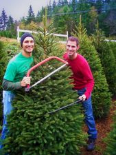 Taylor family getting tree from Christimas Tree farm. Sustainable, local business support.