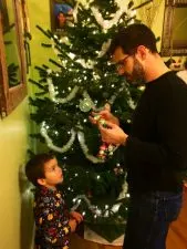 Taylor family decorating a Christmas tree 2015 2