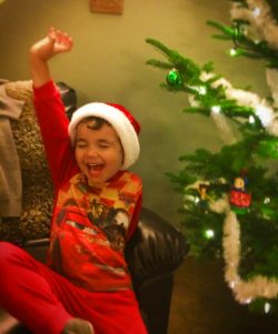 Kids love decorating a Christmas tree just as much as adults. A wonderful Christmas tradition. 2traveldads.com