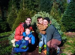 Taylor family getting tree from Christimas Tree farm. Sustainable, local business support. Christmas traditions.